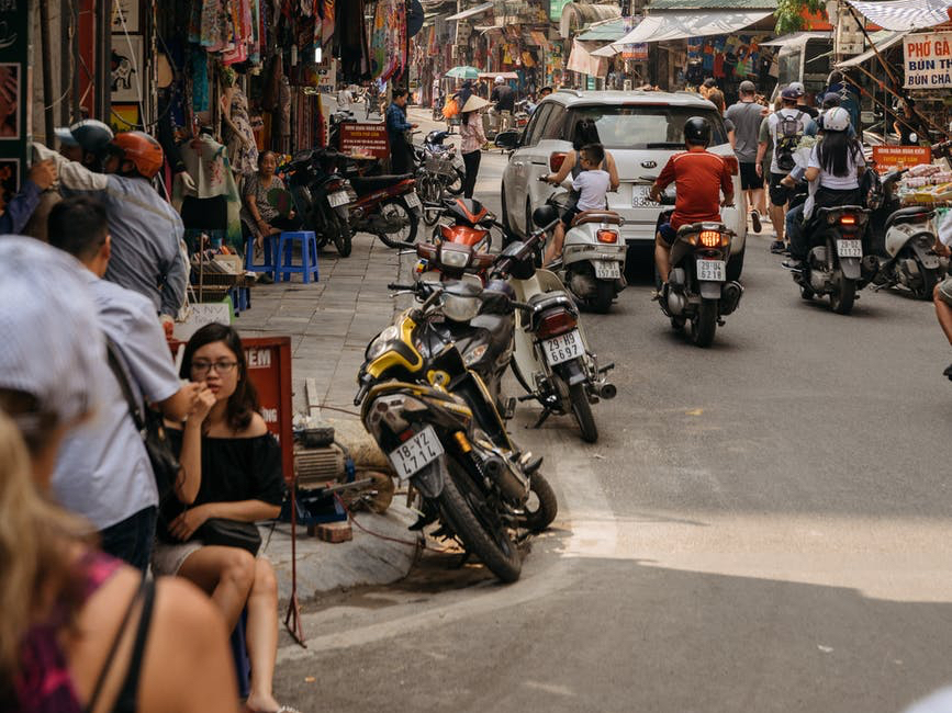 people sitting on sidewalk
